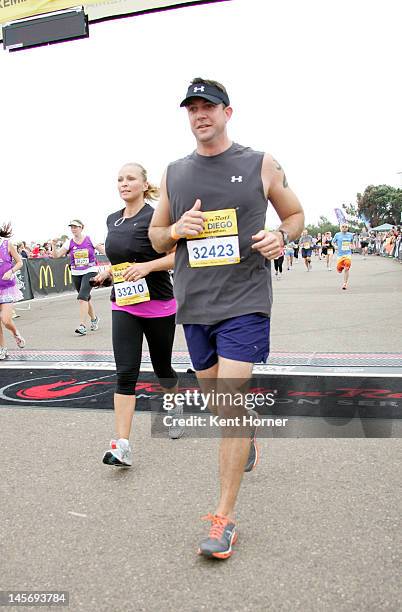 Congressman Duncan Hunter Jr. And wife Margaret cross the finish line of the Rock 'n' Roll Marathon on June 3, 2012 in San Diego, California.