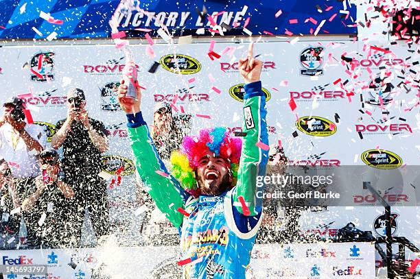 Jimmie Johnson, driver of the Lowe's Madagascar Chevrolet, celebrates in Victory Lane after winning the NASCAR Sprint Cup Series FedEx 400 benefiting...