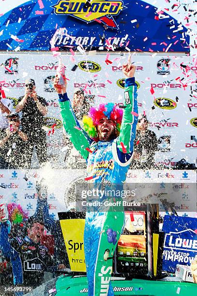Jimmie Johnson, driver of the Lowe's Madagascar Chevrolet, celebrates in Victory Lane after winning the NASCAR Sprint Cup Series FedEx 400 benefiting...