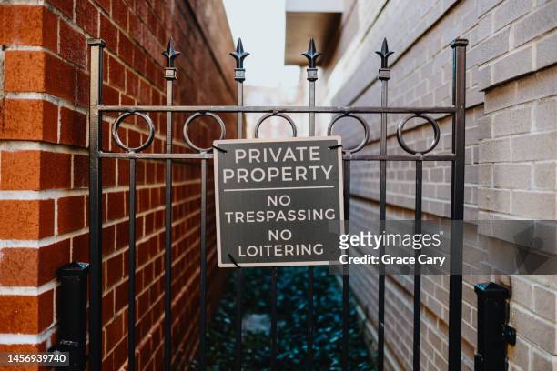 no trespassing sign on gate - private property stock pictures, royalty-free photos & images