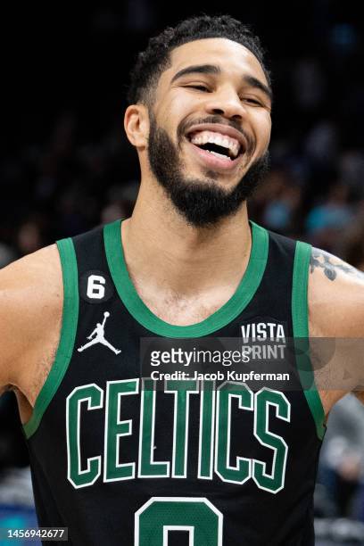Jayson Tatum of the Boston Celtics smiles after defeating the Charlotte Hornets during their game at Spectrum Center on January 16, 2023 in...