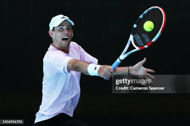 Dominic Thiem of Austria plays a backhand in their round one singles match against Andrey Rublev during day two of the 2023 Australian Open at...