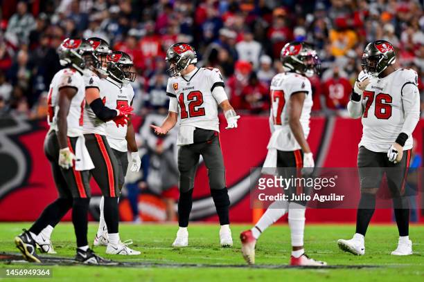 Tom Brady of the Tampa Bay Buccaneers reacts on the field against the Dallas Cowboys during the second quarter in the NFC Wild Card playoff game at...