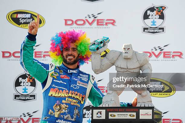 Jimmie Johnson, driver of the Lowe's Madagascar Chevrolet, celebrates in Victory Lane after winning the NASCAR Sprint Cup Series FedEx 400 benefiting...
