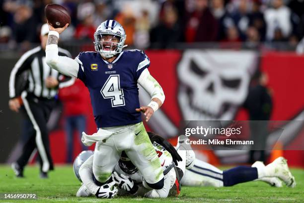 Rakeem Nunez-Roches of the Tampa Bay Buccaneers tackles Dak Prescott of the Dallas Cowboys during the second quarter in the NFC Wild Card playoff...