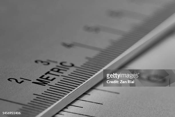stainless steel artist ruler focus on word metric - instrument of measurement stock pictures, royalty-free photos & images