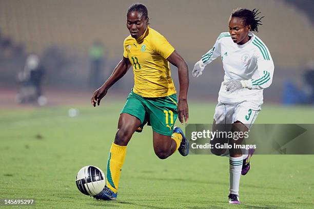 Noko Matlou and Ebere Ngozi during the Womens International Friendly match between South Africa and Nigeria at Royal Bafokeng Stadium on June 03,...