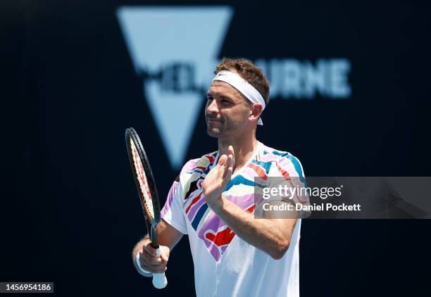 Grigor Dimitrov of Bulgaria celebrates match point in their round one singles match against Aslan Karatsev during day two of the 2023 Australian Open...