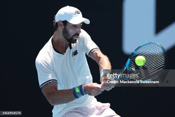 Jordan Thompson of Australia plays a backhand in their round one singles match against J.J. Wolf of the United States during day two of the 2023...