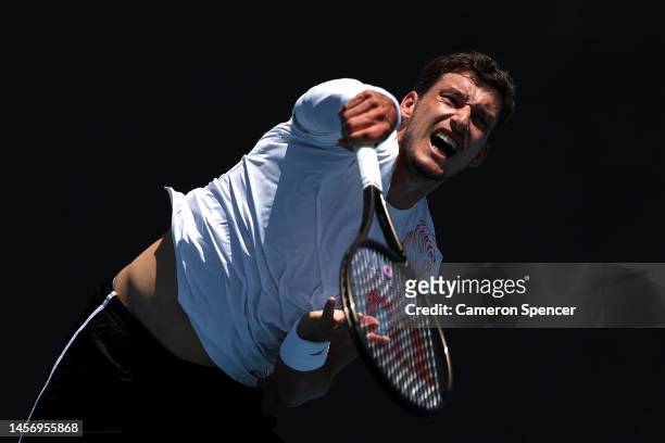Pablo Carreno Busta serves in their round one singles match against Pedro Cauchin of Argentina during day two of the 2023 Australian Open at...