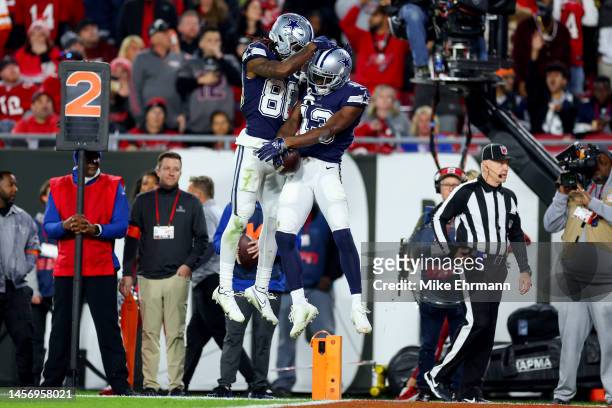Michael Gallup of the Dallas Cowboys celebrates with CeeDee Lamb after scoring a touchdown against the Tampa Bay Buccaneers during the third quarter...