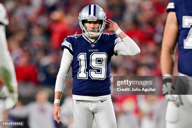 Brett Maher of the Dallas Cowboys reacts after missing an extra point against the Tampa Bay Buccaneers during the third quarter in the NFC Wild Card...