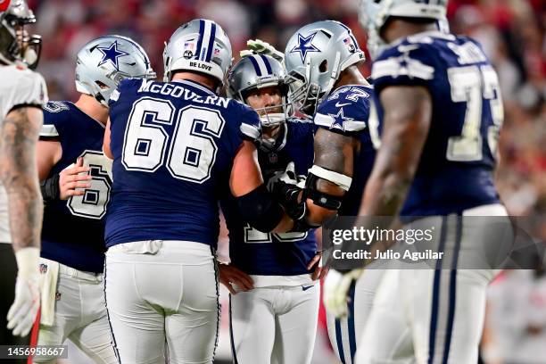 Brett Maher of the Dallas Cowboys reacts after missing an extra point against the Tampa Bay Buccaneers during the third quarter in the NFC Wild Card...