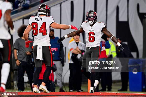 Julio Jones of the Tampa Bay Buccaneers celebrates with Cameron Brate after catching a pass for a touchdown against the Dallas Cowboys during the...