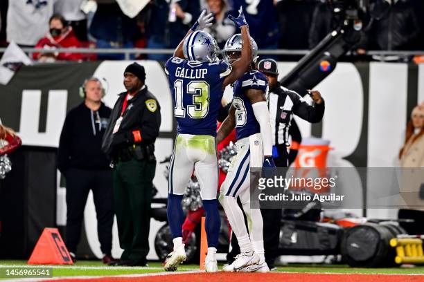 CeeDee Lamb of the Dallas Cowboys celebrates with Michael Gallup after scoring a touchdown against the Tampa Bay Buccaneers during the fourth quarter...