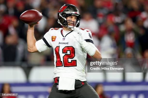 Tom Brady of the Tampa Bay Buccaneers throws a pass against the Dallas Cowboys during the second half in the NFC Wild Card playoff game at Raymond...