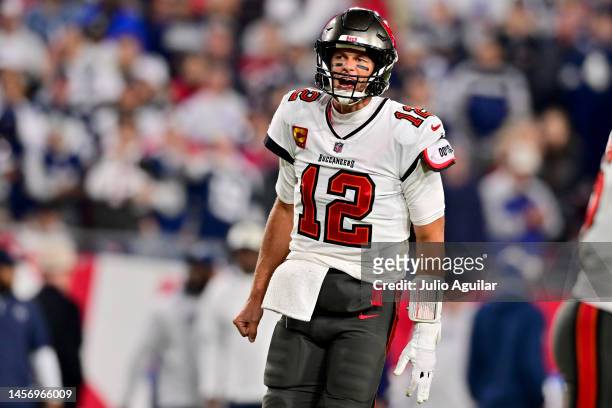 Tom Brady of the Tampa Bay Buccaneers reacts after a play against the Dallas Cowboys during the fourth quarter in the NFC Wild Card playoff game at...