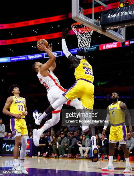 Eric Gordon of the Houston Rockets takes a shot against Wenyen Gabriel of the Los Angeles Lakers in the first half at Crypto.com Arena on January 16,...