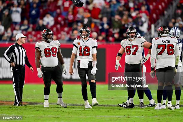 Tom Brady of the Tampa Bay Buccaneers looks on against the Dallas Cowboys during the fourth quarter in the NFC Wild Card playoff game at Raymond...