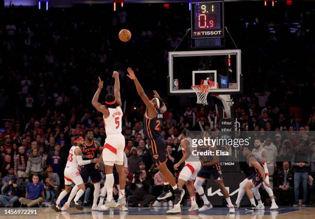 Precious Achiuwa of the Toronto Raptors takes a shot as Mitchell Robinson of the New York Knicks defends during the second half at Madison Square...