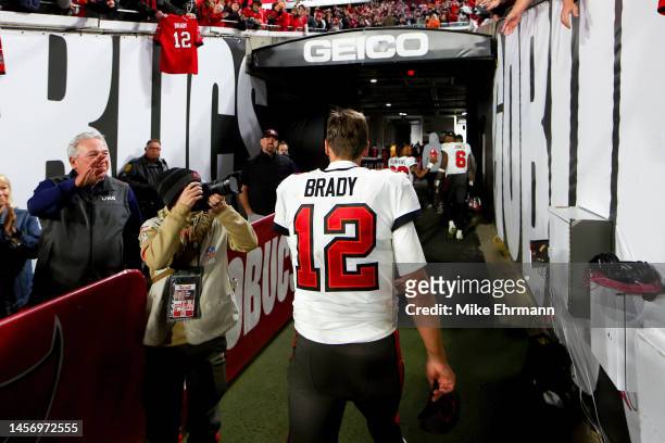 Tom Brady of the Tampa Bay Buccaneers walks off the field after losing to the Dallas Cowboys 31-14 in the NFC Wild Card playoff game at Raymond James...