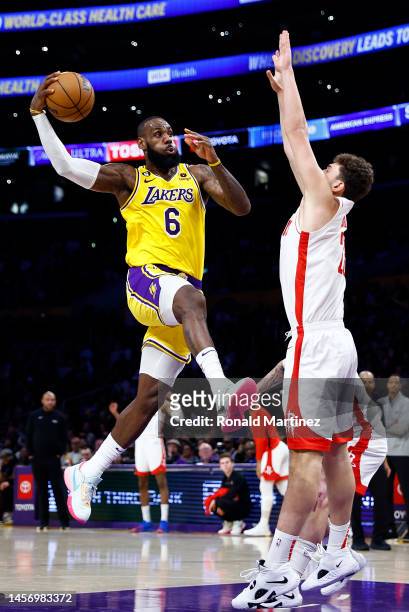 LeBron James of the Los Angeles Lakers passes the ball against Alperen Sengun of the Houston Rockets in the second half at Crypto.com Arena on...