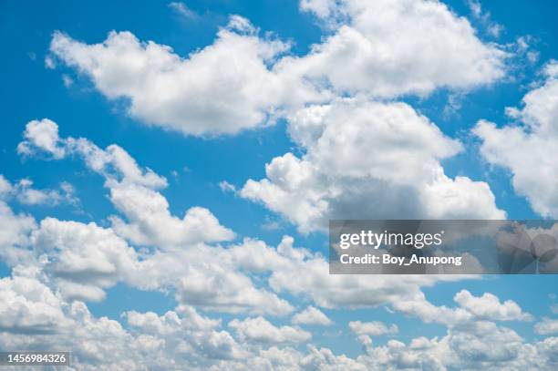 blue sky background with white tiny clouds. - cumulus stockfoto's en -beelden