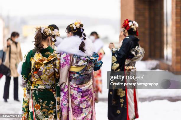 young adult japanese women at traditional seijin no hi (coming of age day) ceremony - kimono winter stock pictures, royalty-free photos & images