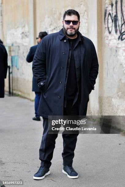 Salvatore Esposito is seen wearing a Ermenegildo Zegna sunglasses, long black trench coat, black pants and shirt outside the Ermenegildo Zegna show...