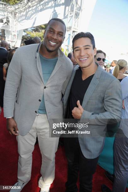 Player Antonio Gates and TV Personality Mario Lopez arrive at the 2012 MTV Movie Awards held at Gibson Amphitheatre on June 3, 2012 in Universal...