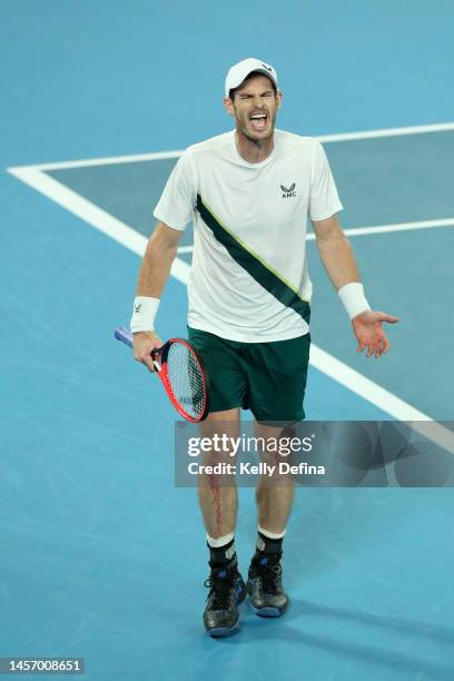 Andy Murray of Great Britain reacts in their round one singles match against Matteo Berrettini of Italy during day two of the 2023 Australian Open at...