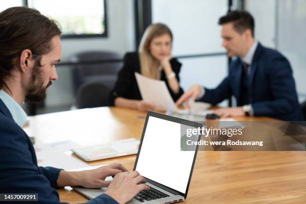 meeting recording, official collecting information meeting into database on laptop while meeting with team in conference room - succession planning stock pictures, royalty-free photos & images