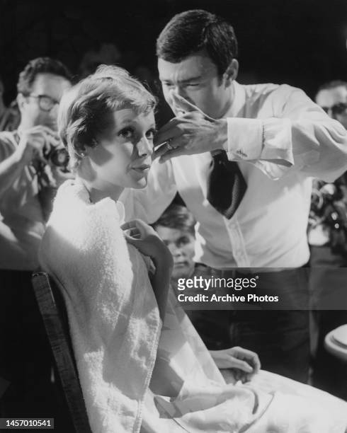 American actress Mia Farrow having her pixie cut trimmed by British hairstylist Vidal Sassoon on the set of 'Rosemary's Baby' at Paramount Studios in...