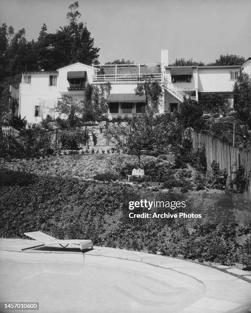 The home of American actress Eve Arden, on a hillside in Hollywood, Los Angeles, California, 1955. The property's swimming pool is partially visible...