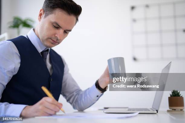 businessman signing contract agreement on paper document for operations on office desk - notar stock-fotos und bilder