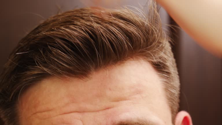 https://media.gettyimages.com/id/1457010736/video/close-up-of-the-male-crown-a-man-combs-his-short-hair.jpg?b=1&s=640x640&k=20&c=S4qrJNep6Ub8HOAdYO1k1AWKSTp3mobsaSpygHXwVqI=