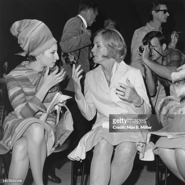American actress and singer Barbra Streisand, wearing striped dress and matching turban, and American actress Eva Marie Saint attend a pro-Israel...