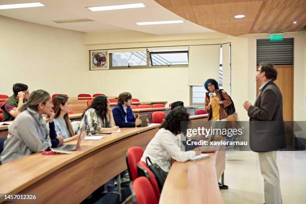 university student arriving late and interrupting class - arriving late class stockfoto's en -beelden