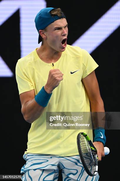 Holger Rune of Denmark celebrates match point in their round one singles match against Filip Krajinovic of Serbia during day two of the 2023...