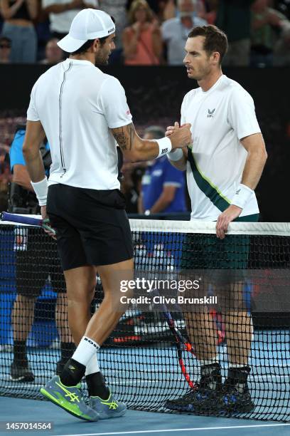 Andy Murray of Great Britain shakes hands with Matteo Berrettini of Italy after winning their round one singles match during day two of the 2023...