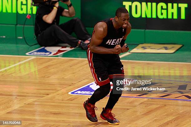 Dwyane Wade of the Miami Heat reacts as he missed the final field goal attempt of the game in overtime against the Boston Celtics in Game Four of the...