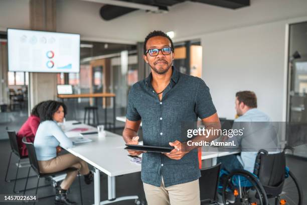 indoor portrait of a male manager - marketing director stock pictures, royalty-free photos & images