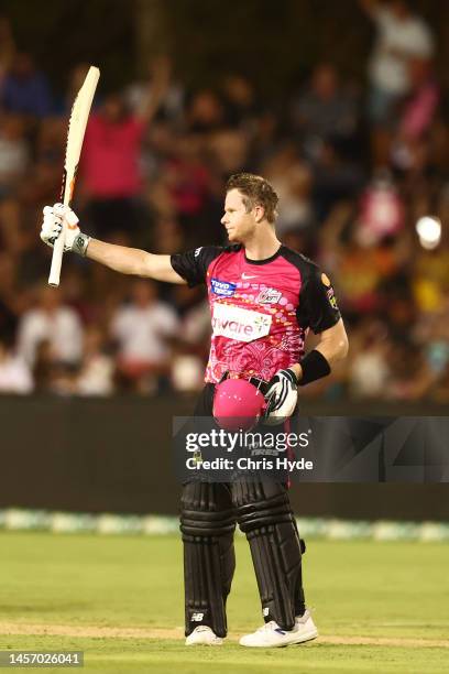 Steve Smith of the Sixers celebrates a century during the Men's Big Bash League match between the Sydney Sixers and the Adelaide Strikers at Coffs...