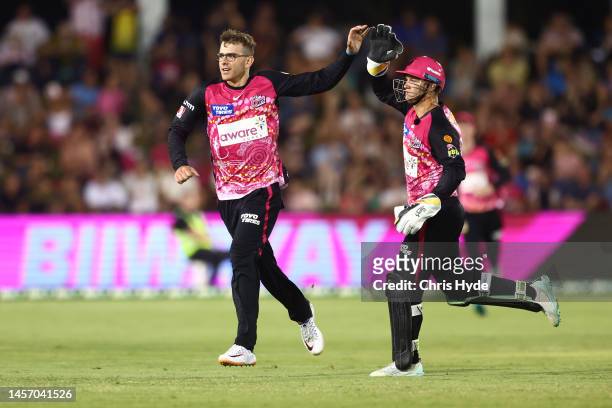 Todd Murphy of the Sixers celebrates dismissing Matt Short of the Strikers during the Men's Big Bash League match between the Sydney Sixers and the...