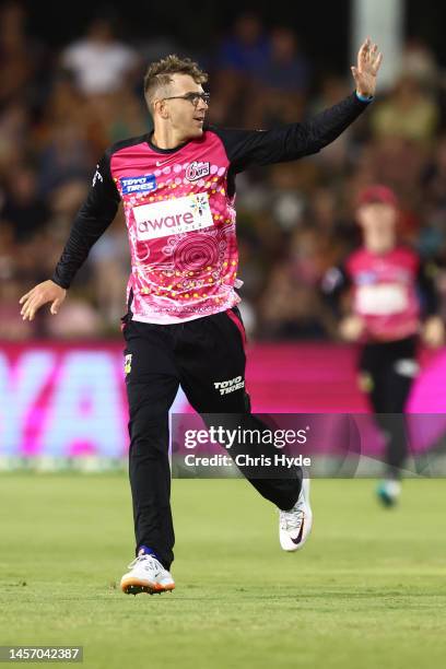 Todd Murphy of the Sixers celebrates dismissing Matt Short of the Strikers during the Men's Big Bash League match between the Sydney Sixers and the...