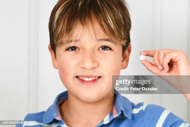 boy showing his medication - codeine stock pictures, royalty-free photos & images