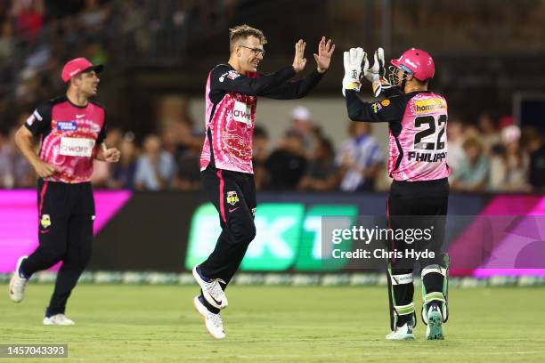 Todd Murphy of the Sixers celebrates dismissing Adam Hose of the Strikers during the Men's Big Bash League match between the Sydney Sixers and the...