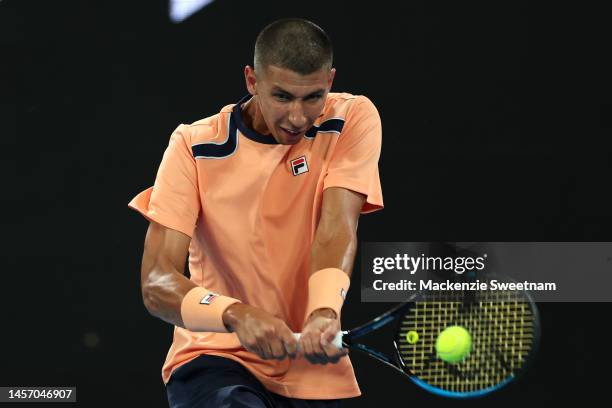 Alexei Popyrin of Australia plays a backhand in their round one singles match against Chun-Hsin Tseng of Taiwan during day two of the 2023 Australian...