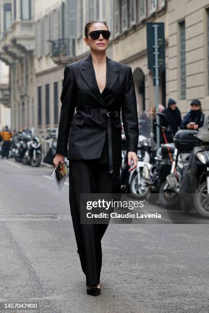 Azzurra Bertelli is seen wearing black jacket with belt and suit pants outside the Giorgio Armani show during the Milan Menswear Fall/Winter...