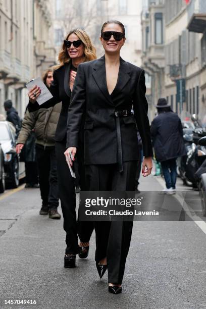 Azzurra Bertelli is seen wearing black jacket with belt and suit pants outside the Giorgio Armani show during the Milan Menswear Fall/Winter...
